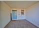 Inviting entryway with blue door and tile floor at 16850 Whisper Elm St, Wimauma, FL 33598