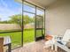 Relaxing screened porch overlooking a grassy backyard at 1100 Multiflora Loop, Lutz, FL 33558