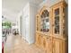 Elegant wood china cabinet in hallway at 1100 Multiflora Loop, Lutz, FL 33558