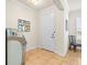 Bright entryway with tiled floors and white door at 1100 Multiflora Loop, Lutz, FL 33558