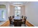 Formal dining room featuring a wood table and chairs, hardwood floors, and a chandelier at 3107 Red Lion Dr, Valrico, FL 33596