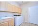 Laundry room with washer, dryer, and cabinets at 3107 Red Lion Dr, Valrico, FL 33596