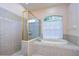 Spa-like bathroom with a large soaking tub and shower at 3107 Red Lion Dr, Valrico, FL 33596