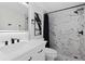 Modern bathroom with marble shower and vanity at 6291 Bahia Del Mar Cir # 103, St Petersburg, FL 33715