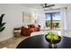 Bright living room with water view, featuring comfortable couch and decor at 6291 Bahia Del Mar Cir # 103, St Petersburg, FL 33715