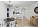 Bright dining room with a modern chandelier and seating for four at 6291 Bahia Del Mar Cir # 103, St Petersburg, FL 33715