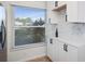 Kitchen corner with white cabinets, quartz countertops, and a window with blinds at 6291 Bahia Del Mar Cir # 103, St Petersburg, FL 33715