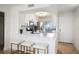 Modern kitchen with white cabinets, quartz countertops and breakfast bar at 6291 Bahia Del Mar Cir # 103, St Petersburg, FL 33715