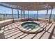 Relaxing hot tub under a shaded pergola at 6291 Bahia Del Mar Cir # 103, St Petersburg, FL 33715
