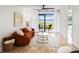 Living room with water view and access to patio at 6291 Bahia Del Mar Cir # 103, St Petersburg, FL 33715