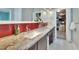 Double vanity bathroom with granite countertop and red tile at 4514 Gentrice Dr, Valrico, FL 33596