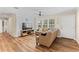 Living room with L-shaped sofa and wood-look floors at 30443 Lynne Dr, Wesley Chapel, FL 33543