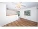 Living room with hardwood floors and sliding glass doors at 1001 Chinaberry Rd, Clearwater, FL 33764