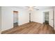 Bright bedroom with wood-look floors and access to bathroom at 1001 Chinaberry Rd, Clearwater, FL 33764