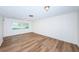 Bright living room featuring light walls and wood-look floors at 1001 Chinaberry Rd, Clearwater, FL 33764