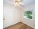 Simple bedroom with wood-look floors and a window at 1001 Chinaberry Rd, Clearwater, FL 33764