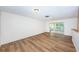 Living room with brick accent wall and sliding glass doors to patio at 1001 Chinaberry Rd, Clearwater, FL 33764