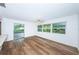 Spacious dining area with wood-look floors and access to a patio at 1001 Chinaberry Rd, Clearwater, FL 33764
