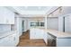 Updated kitchen featuring white shaker cabinets and granite countertops at 1001 Chinaberry Rd, Clearwater, FL 33764