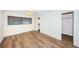 Spacious bedroom with wood-look floors and ample closet space at 1001 Chinaberry Rd, Clearwater, FL 33764