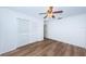 Bright bedroom with wood-look floors and double door closet at 1001 Chinaberry Rd, Clearwater, FL 33764