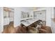 Dining room with a marble table, and view into kitchen at 1001 Chinaberry Rd, Clearwater, FL 33764