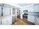 Modern kitchen with stainless steel appliances and white cabinetry at 1001 Chinaberry Rd, Clearwater, FL 33764