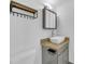 This bathroom features tiled vanity and large mirror for storage at 233 W College Ave, Ruskin, FL 33570