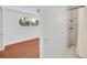 Bathroom featuring tiled shower and flooring and a window to the bedroom at 233 W College Ave, Ruskin, FL 33570
