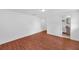 Bedroom features hardwood floors, closet space and access to the bathroom at 233 W College Ave, Ruskin, FL 33570