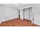 Large bedroom features hardwood floors, access to a closet and to another room at 233 W College Ave, Ruskin, FL 33570