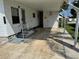 Covered carport area alongside a cozy home with a small storage area at 2331 Belleair Rd # Lot 237, Clearwater, FL 33764