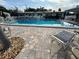 Relaxing community pool area with lounge chairs, offering a perfect spot for leisure at 2331 Belleair Rd # Lot 237, Clearwater, FL 33764
