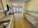 Bright kitchen with matching white appliances, ample cabinetry and luxury vinyl plank flooring at 2331 Belleair Rd # Lot 237, Clearwater, FL 33764