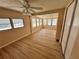Well-lit open living space with windows and wood flooring at 2331 Belleair Rd # Lot 237, Clearwater, FL 33764