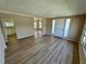 Spacious living room with continuous flooring and a view through to the kitchen and hallway at 2331 Belleair Rd # Lot 237, Clearwater, FL 33764