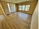 Bright living room featuring new vinyl flooring and a fresh coat of paint at 2331 Belleair Rd # Lot 237, Clearwater, FL 33764