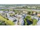 Aerial view of community featuring a pond, lush landscaping and nearby highway at 621 99Th N Ave # 102, St Petersburg, FL 33702