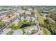Scenic aerial view of community with pond and landscaped grounds near highway at 621 99Th N Ave # 102, St Petersburg, FL 33702