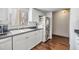 Bright kitchen features white cabinets, dark countertops, and a window for natural light at 621 99Th N Ave # 102, St Petersburg, FL 33702