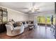 Spacious living room with sliding glass doors to balcony letting in natural light at 621 99Th N Ave # 102, St Petersburg, FL 33702
