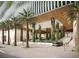 Modern building entrance with lush landscaping and a car at 111 S Ashley Dr # 3002, Tampa, FL 33602