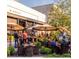 Outdoor patio dining with umbrellas, tables, and lush plants at 111 S Ashley Dr # 3205, Tampa, FL 33602