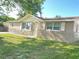 Cute ranch home with stone accents and a lush front yard at 7335 Buchanan Dr, Port Richey, FL 34668