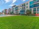 Expansive green space with modern building in background at 1208 E Kennedy Blvd # 715, Tampa, FL 33602