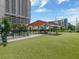 Modern dog park with turf, shaded seating, and fenced areas at 1208 E Kennedy Blvd # 715, Tampa, FL 33602