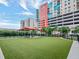 Community dog park with artificial turf and a covered seating area at 1208 E Kennedy Blvd # 715, Tampa, FL 33602