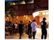 Indoor bar area with wood accents, globe lights, and patrons at 111 S Ashley Dr # 3409, Tampa, FL 33602