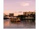 Serene sunset view of a river with a boat and cityscape in the background at 111 S Ashley Dr # 3409, Tampa, FL 33602