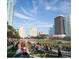 Outdoor yoga class in a Tampa park with city skyline backdrop at 111 S Ashley Dr # 3409, Tampa, FL 33602